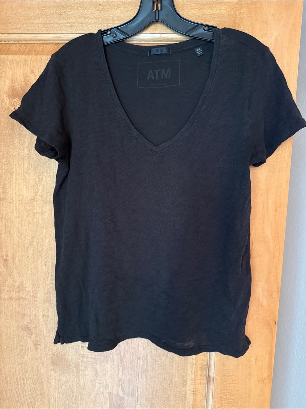 Womenโs M V-neck black ATM slub schoolboy Tshirt.